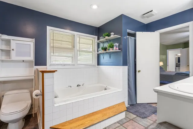a bathroom with a bathtub sink and toilet