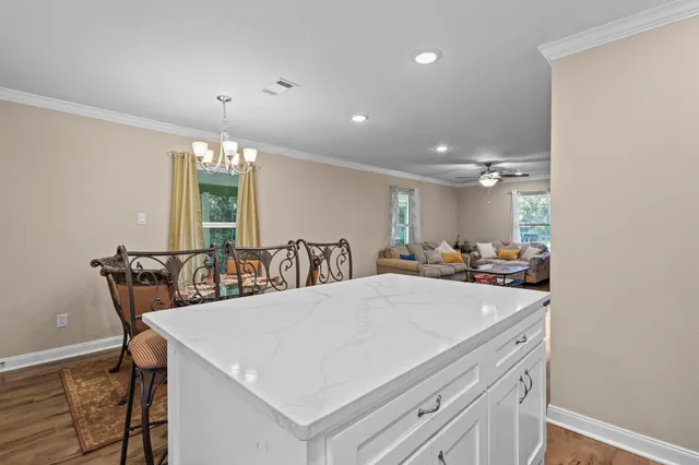 a bathroom with a sink a toilet a mirror and shower curtain