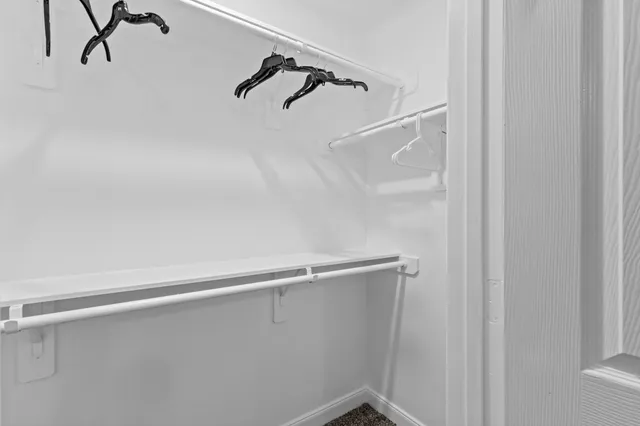 a view of a house with backyard and trees