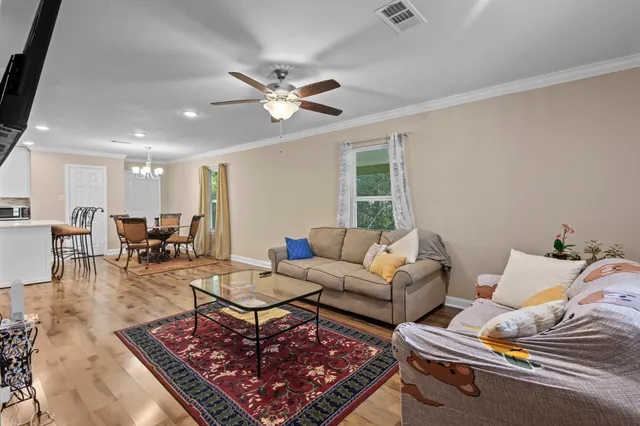 a living room with furniture and a rug