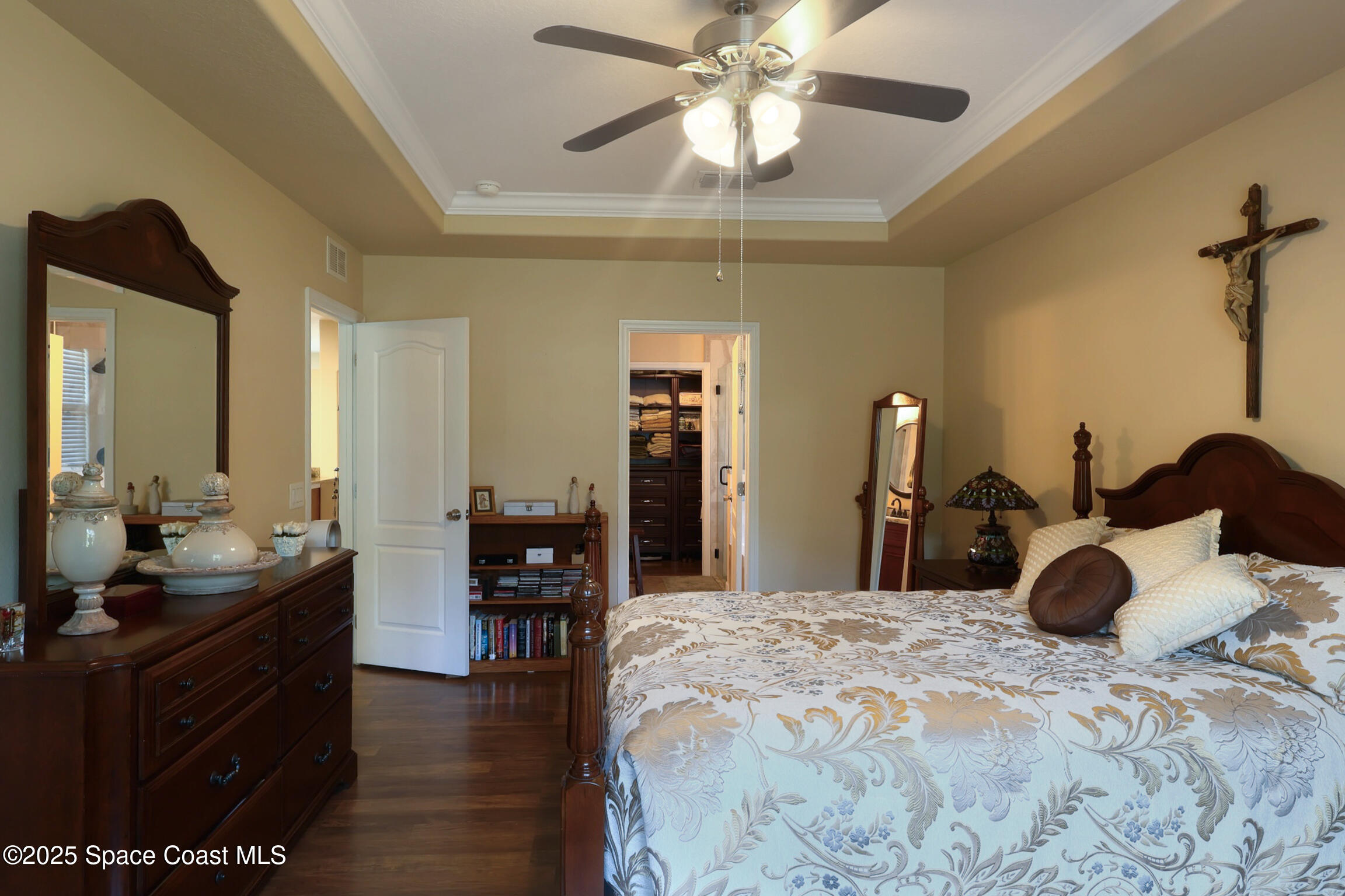 249 Franzing Street Palm Bay, FL 32908 - Photo 11 of 38 a bedroom with a bed and a chandelier