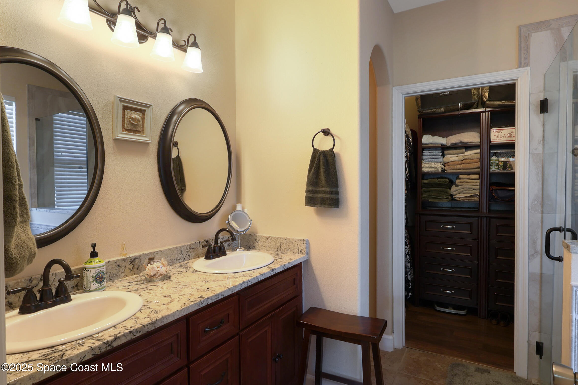 249 Franzing Street Palm Bay, FL 32908 - Photo 12 of 38 a bathroom with a granite countertop sink a mirror and shower