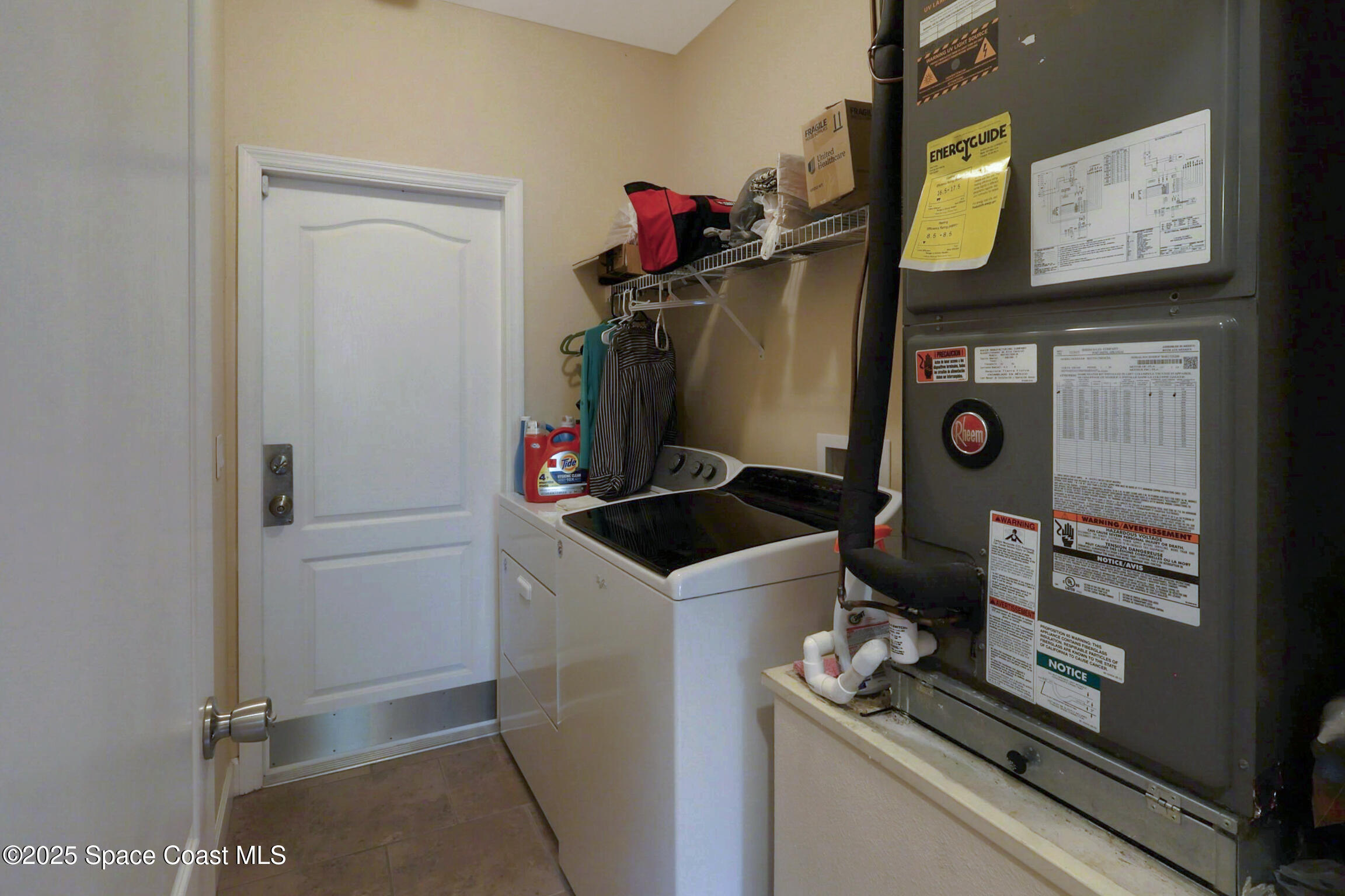249 Franzing Street Palm Bay, FL 32908 - Photo 18 of 38 a utility room with dryer and washer