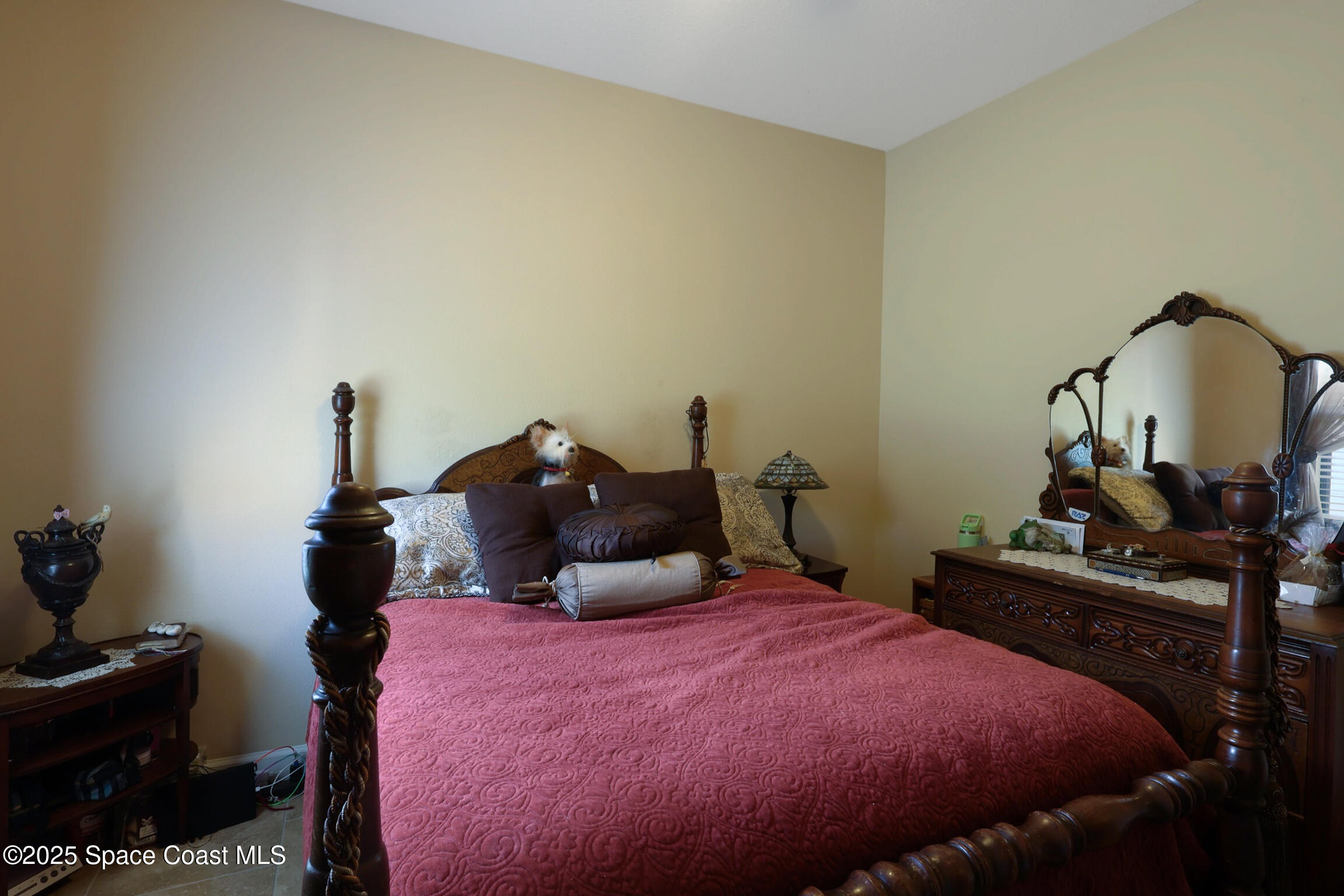 249 Franzing Street Palm Bay, FL 32908 - Photo 20 of 38 a bedroom with a bed and wooden floor