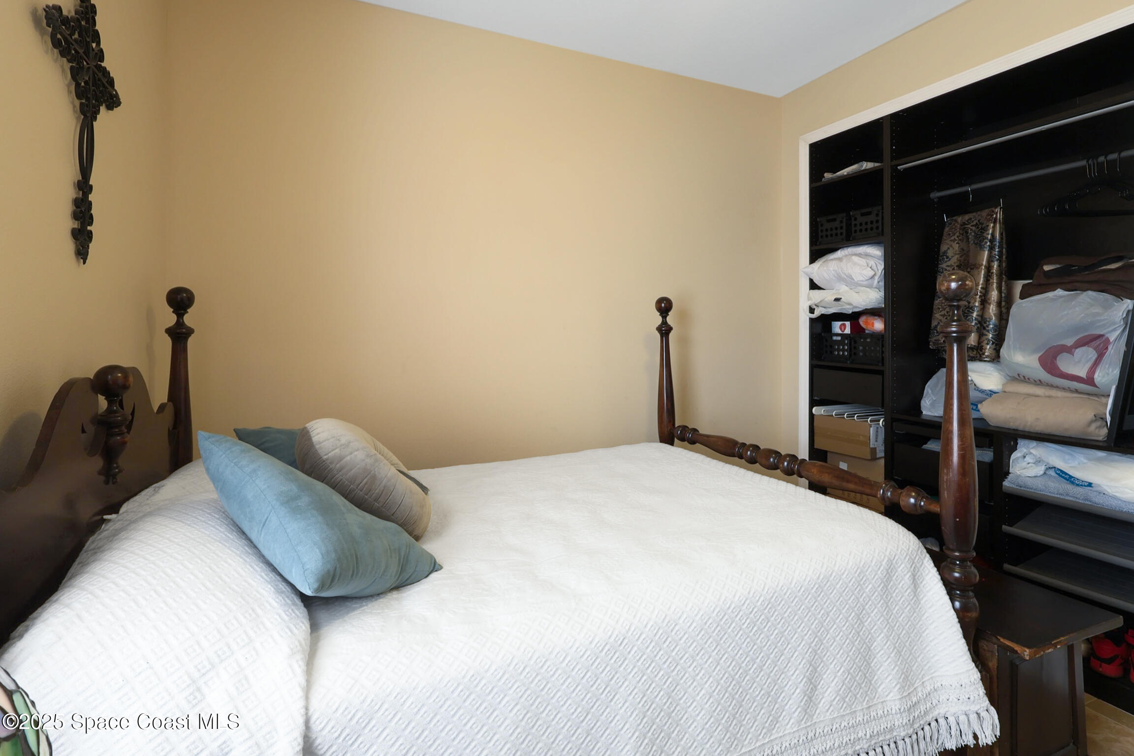249 Franzing Street Palm Bay, FL 32908 - Photo 23 of 38 a bedroom with a bed and a mirror