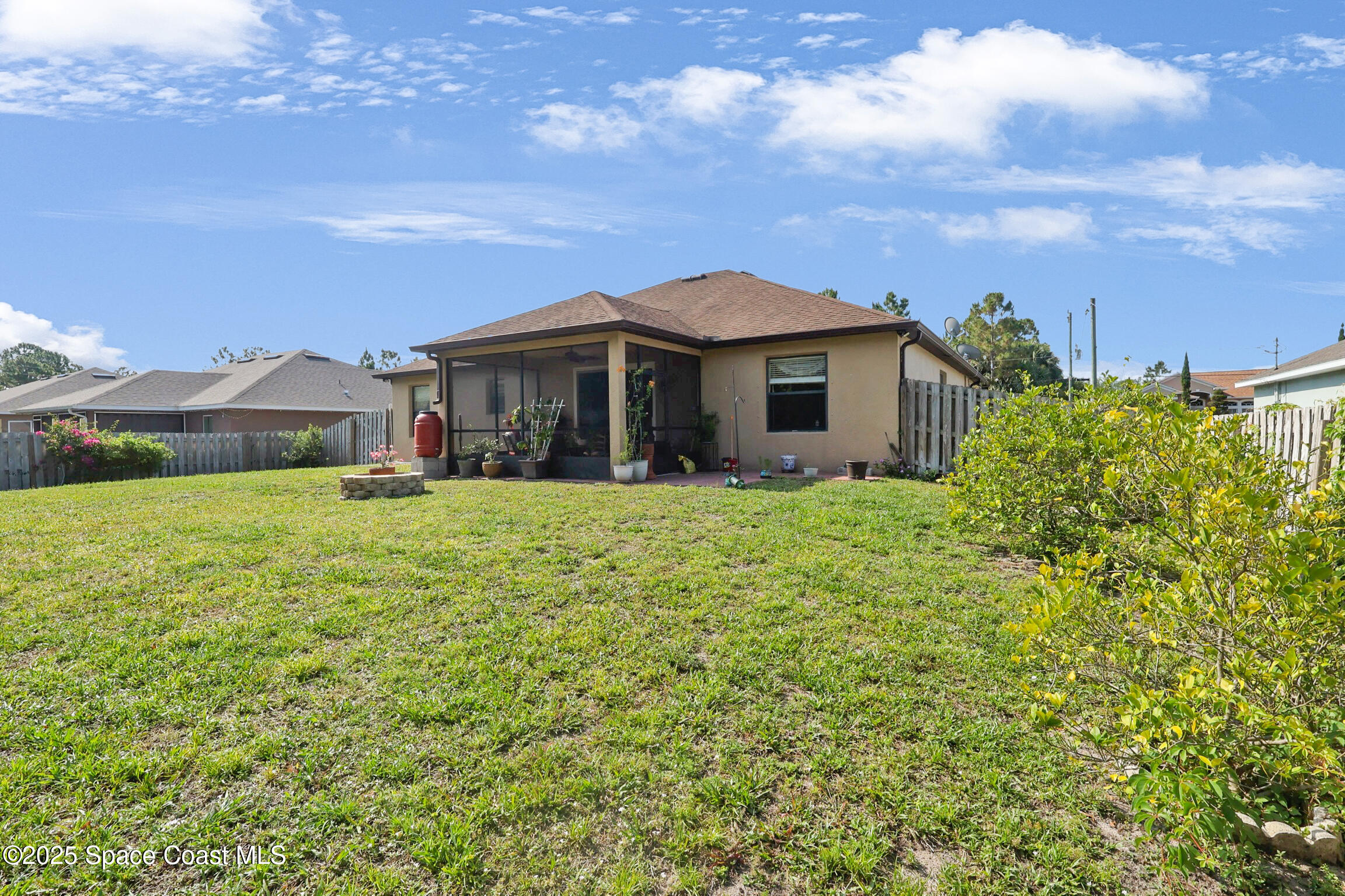 249 Franzing Street Palm Bay, FL 32908 - Photo 27 of 38 a view of a house with a big yard
