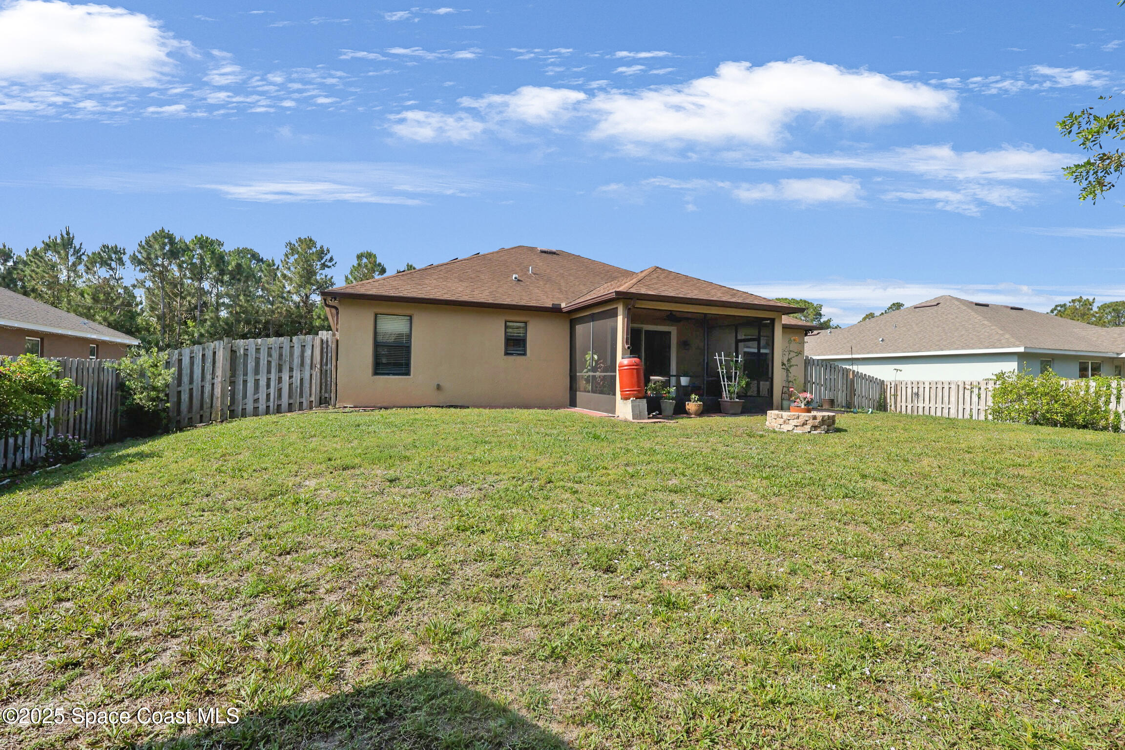 249 Franzing Street Palm Bay, FL 32908 - Photo 28 of 38 a front view of a house with garden