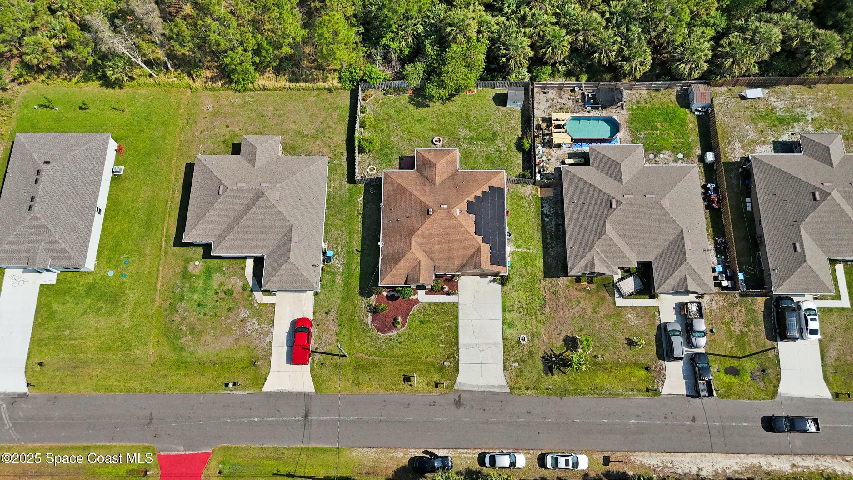 249 Franzing Street Palm Bay, FL 32908 - Photo 38 of 38 an aerial view of residential houses with outdoor space and street view