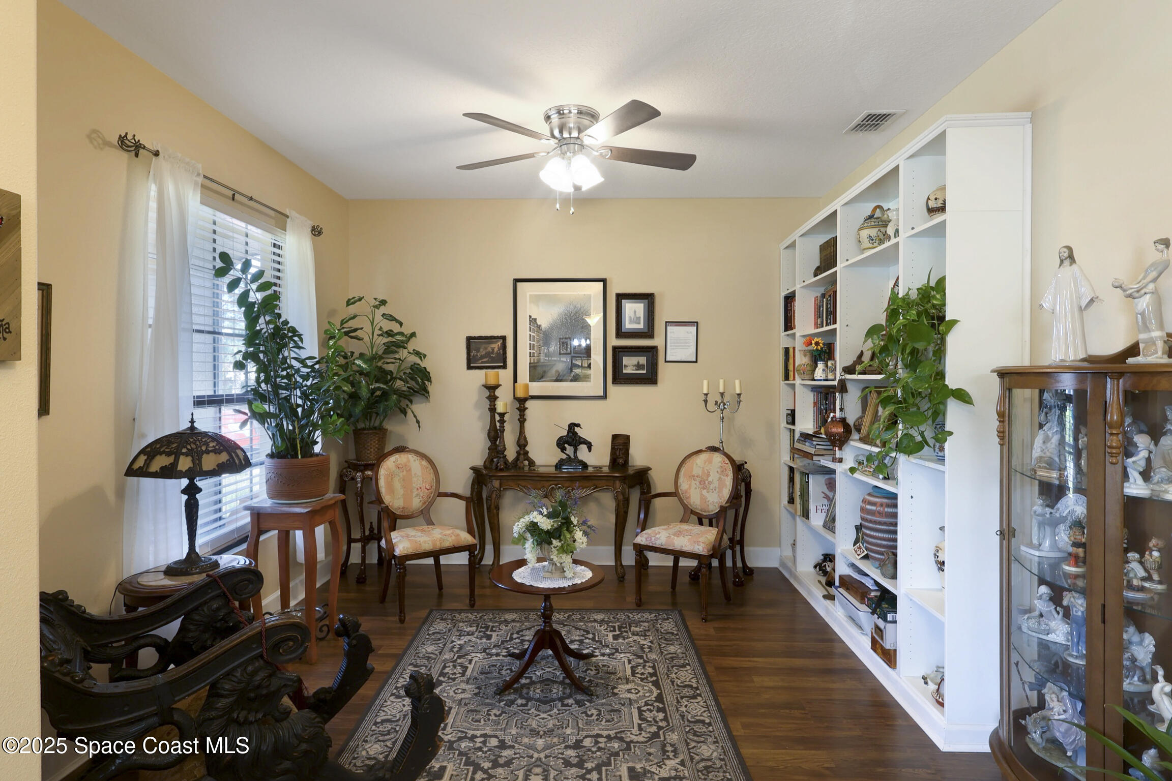 249 Franzing Street Palm Bay, FL 32908 - Photo 5 of 38 a living room with furniture and a bookshelf