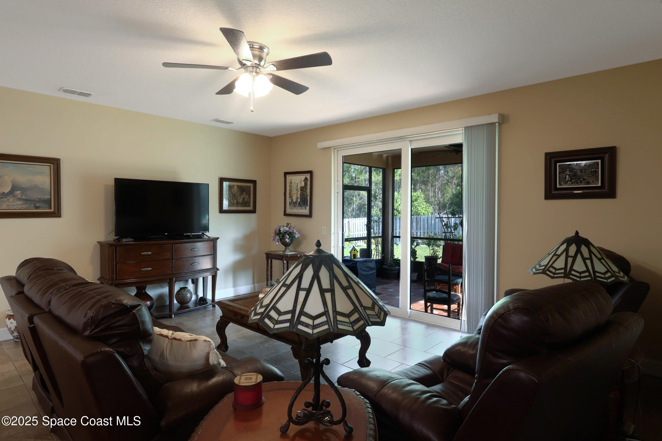 249 Franzing Street Palm Bay, FL 32908 - Photo 9 of 38 a living room with furniture and a flat screen tv