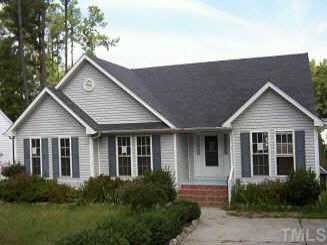 3515 Neptune Drive Raleigh, NC 27604 - Photo 1 of 1 a front view of a house with garden