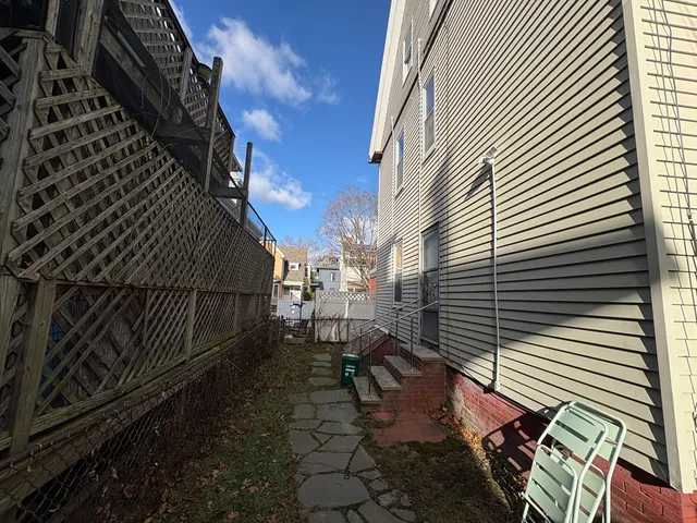 a view of a backyard with sitting area