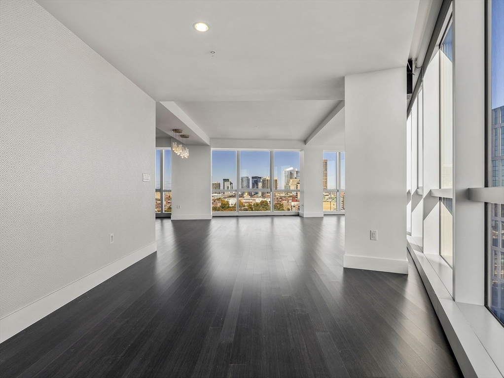 110 Stuart Street, Unit 23G Boston, MA 02116 - Photo 17 of 39 a view of a hallway with wooden floors