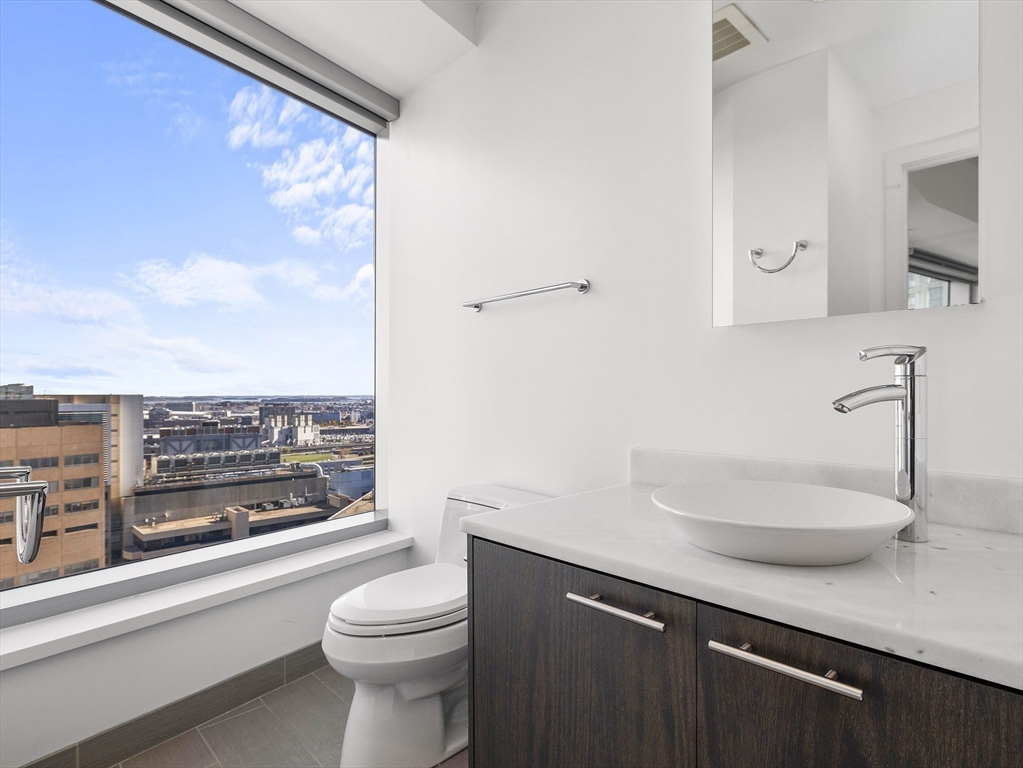 110 Stuart Street, Unit 23G Boston, MA 02116 - Photo 29 of 39 a bathroom with a sink a toilet and shower
