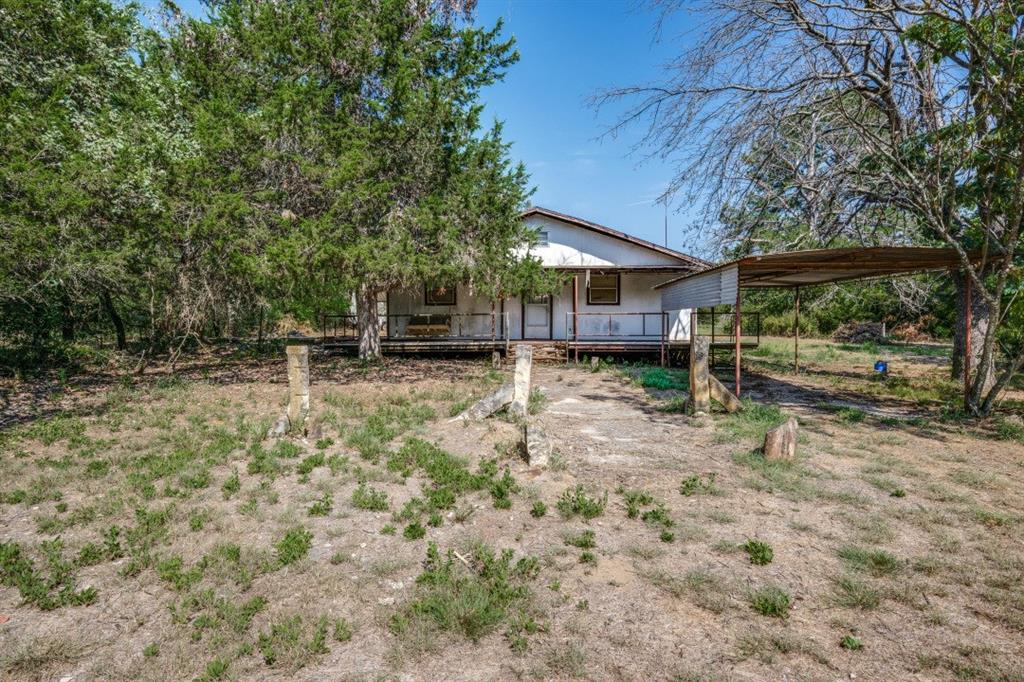 946 County Road 2650 Decatur, TX 76234 - Photo 1 of 1 View of yard with a carport and a porch