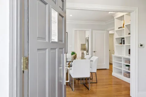 a view of a dining room with furniture and wooden floor
