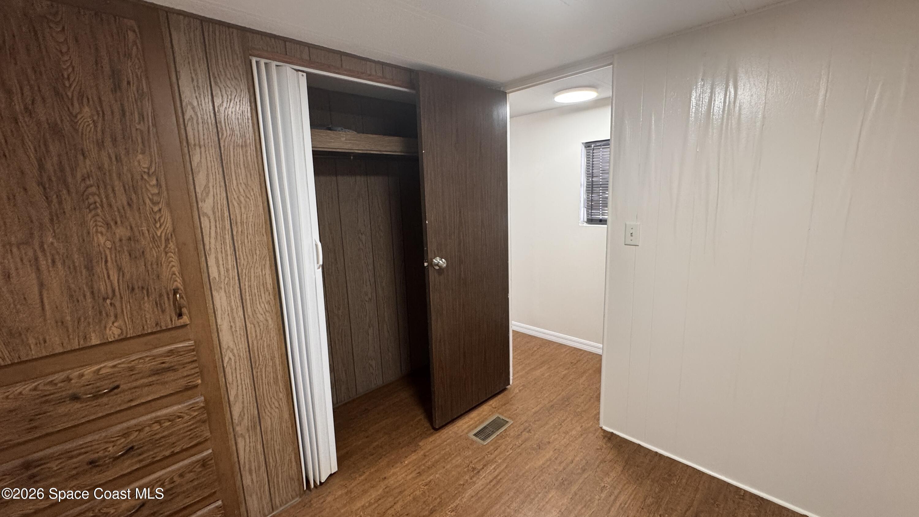 2522 Amberly Road Northeast Palm Bay, FL 32905 - Photo 12 of 13 a view of a hallway with wooden floor