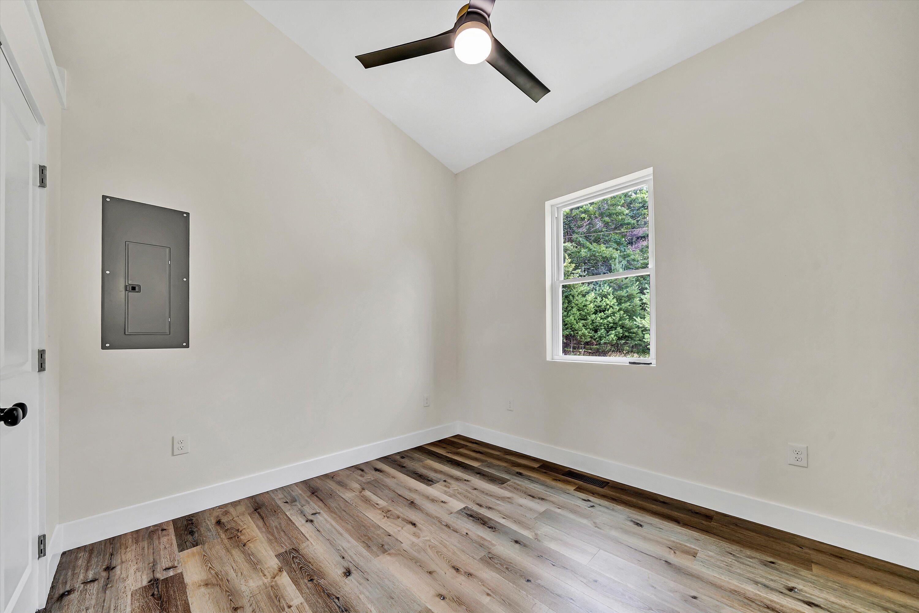1481 Fairview Church Road Southwest Floyd, VA 24091 - Photo 20 of 33 a view of an empty room with a window and wooden floor