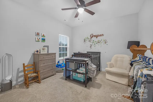 a bedroom with furniture and a window