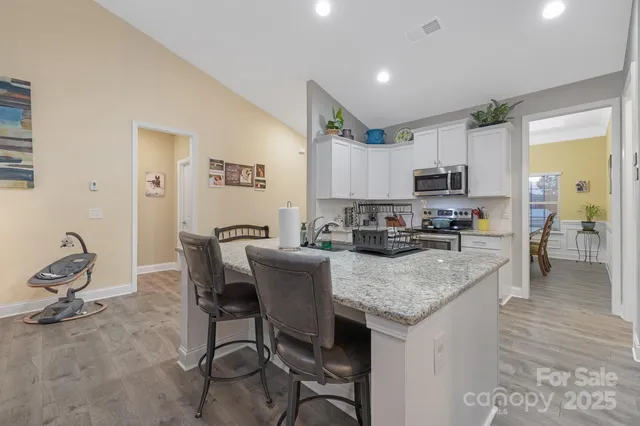a view of kitchen dining table and chairs