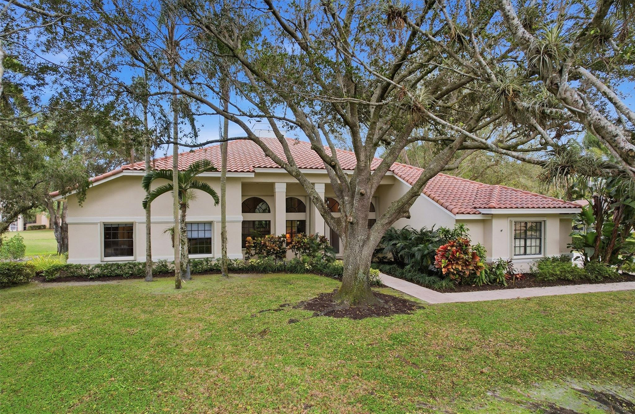 7720 West Upper Ridge Drive Parkland, FL 33067 - Photo 1 of 85 a front view of house with yard and green space