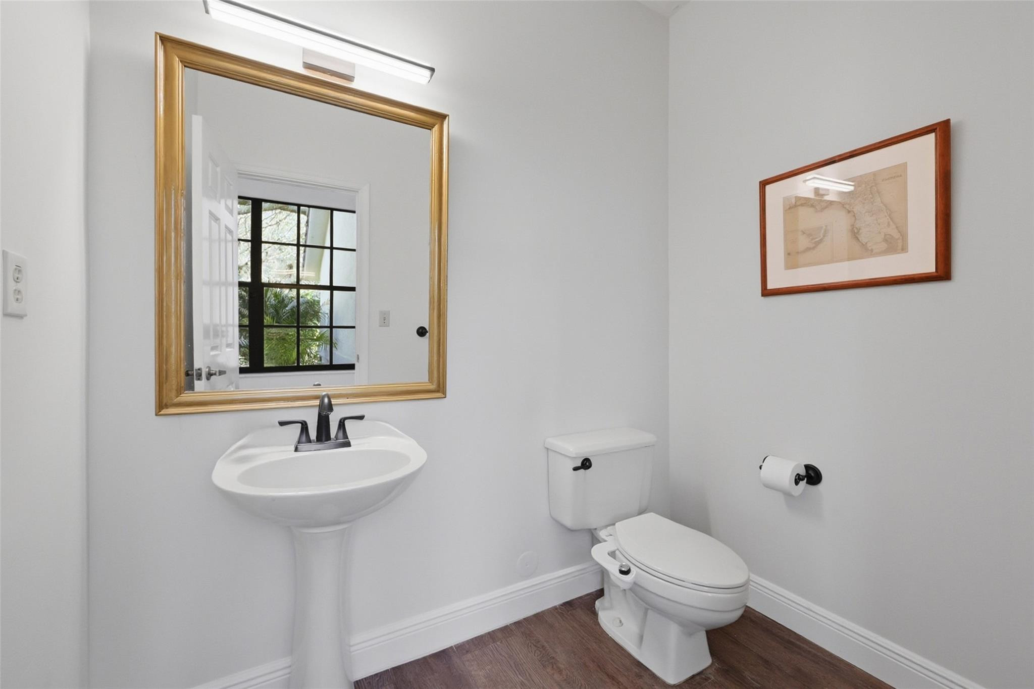 7720 West Upper Ridge Drive Parkland, FL 33067 - Photo 15 of 85 a bathroom with a toilet sink and mirror