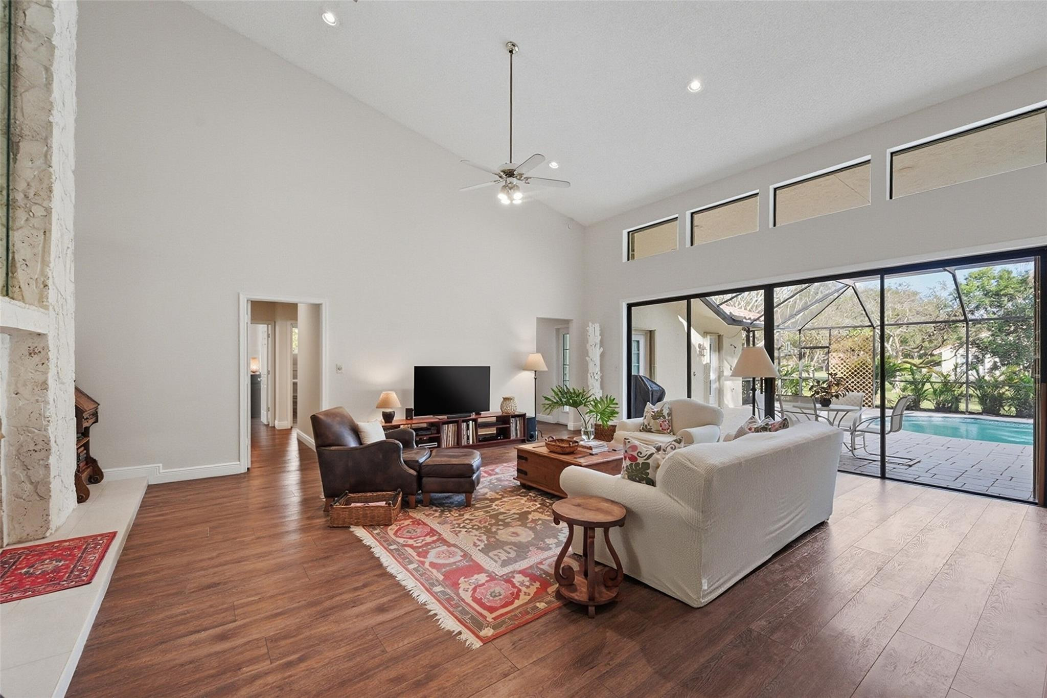 7720 West Upper Ridge Drive Parkland, FL 33067 - Photo 19 of 85 a living room with furniture and a flat screen tv