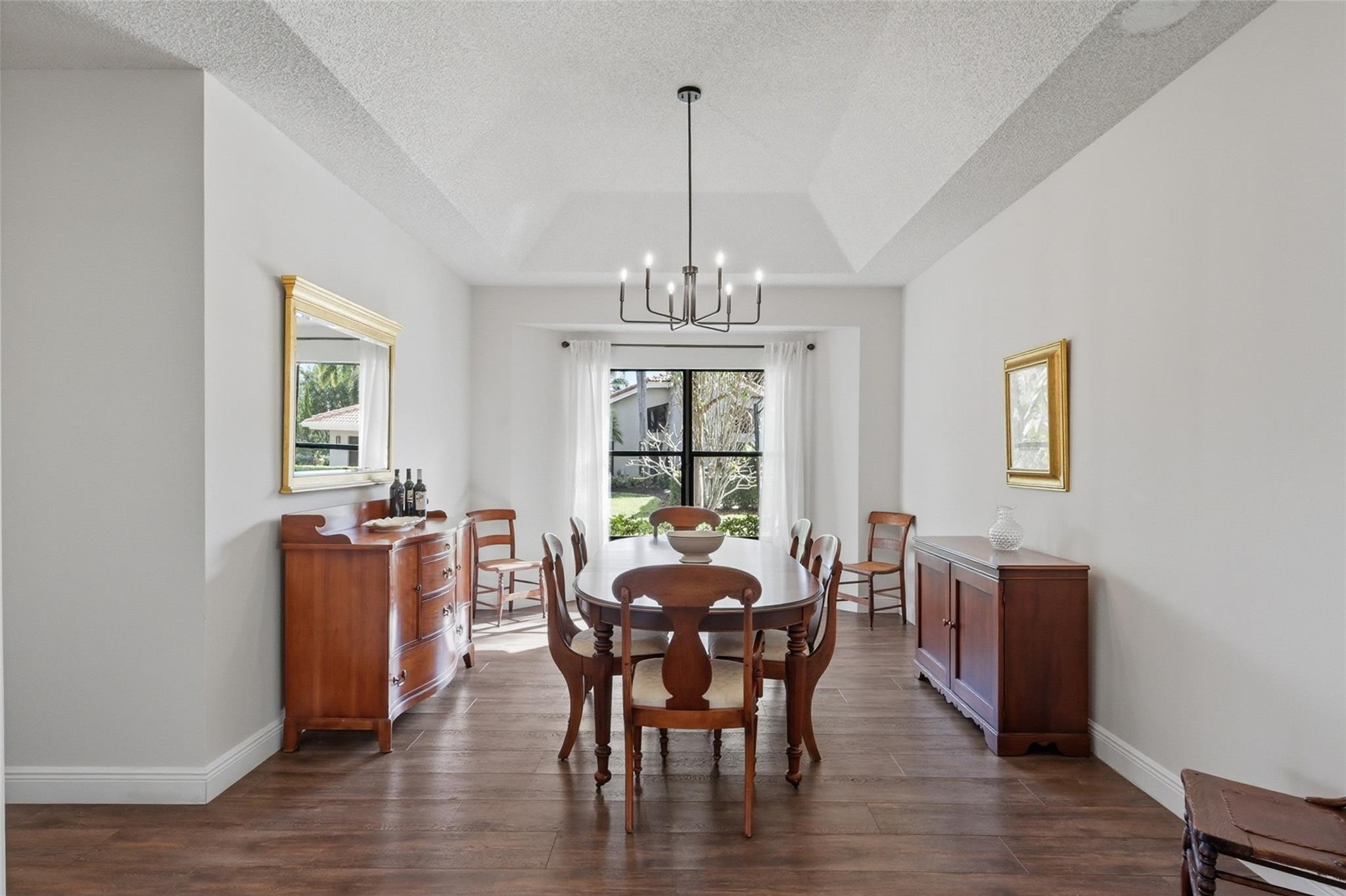 7720 West Upper Ridge Drive Parkland, FL 33067 - Photo 20 of 85 a view of a dining room with furniture window and wooden floor
