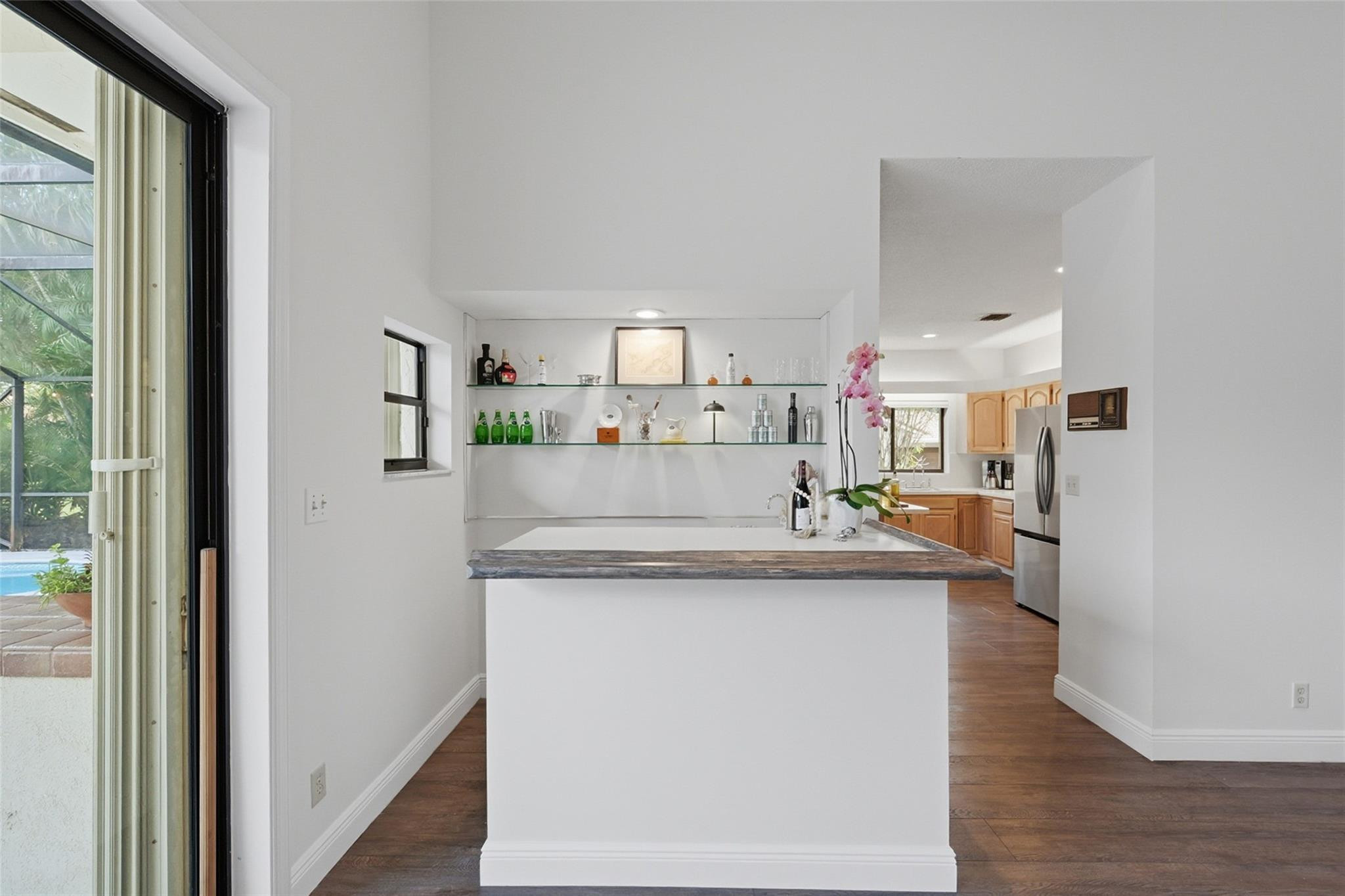 7720 West Upper Ridge Drive Parkland, FL 33067 - Photo 21 of 85 a view of kitchen with cabinets and wooden floor