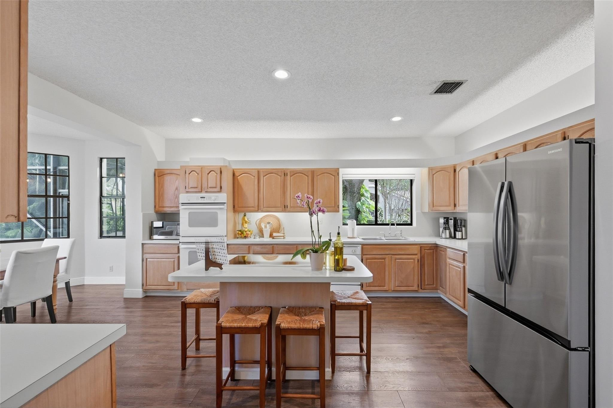 7720 West Upper Ridge Drive Parkland, FL 33067 - Photo 23 of 85 a kitchen with a table and chairs in it