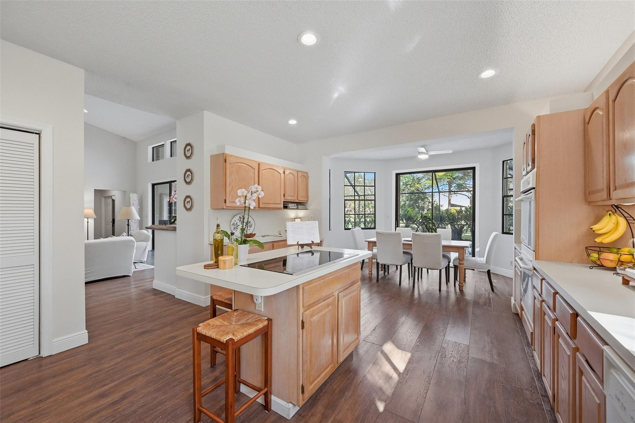 7720 West Upper Ridge Drive Parkland, FL 33067 - Photo 24 of 85 a view of a dining room with furniture and wooden floor