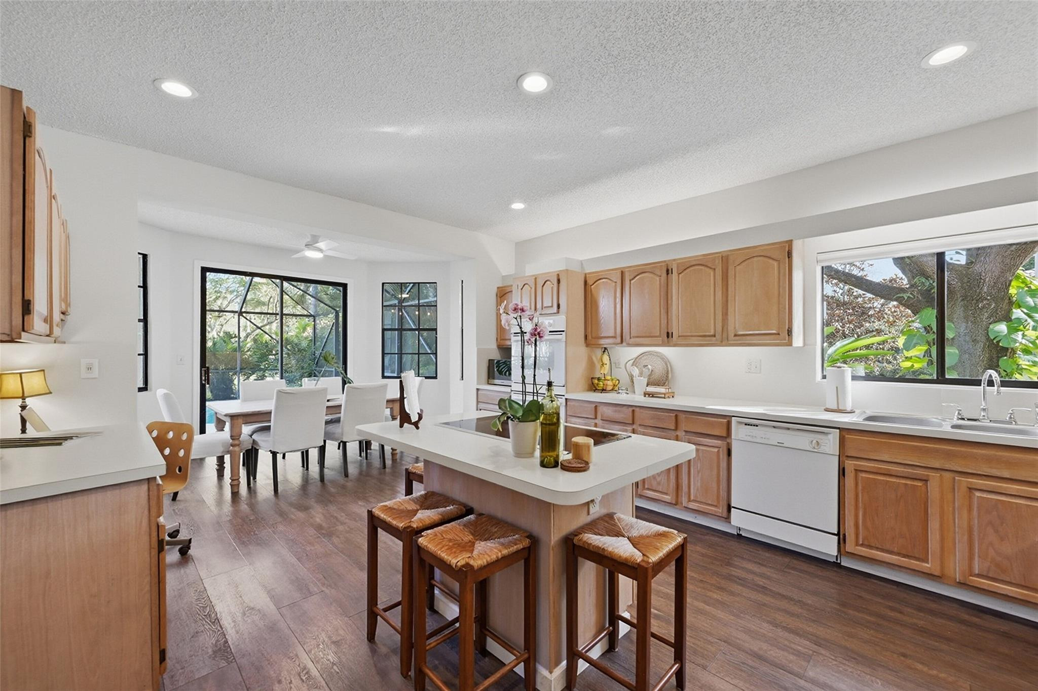 7720 West Upper Ridge Drive Parkland, FL 33067 - Photo 25 of 85 a view of a dining room with furniture window and wooden floor