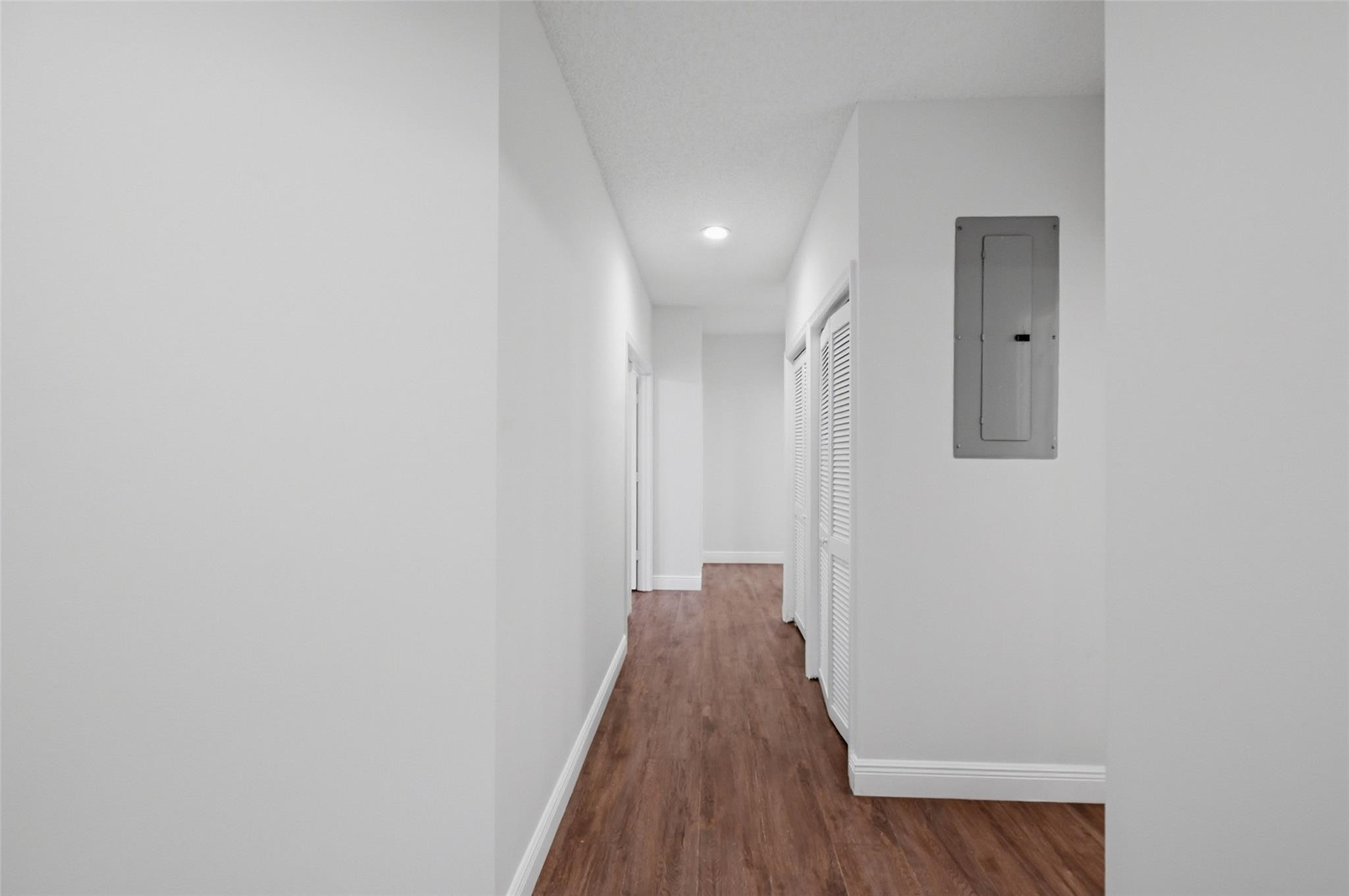 7720 West Upper Ridge Drive Parkland, FL 33067 - Photo 45 of 85 a view of a hallway with wooden floor