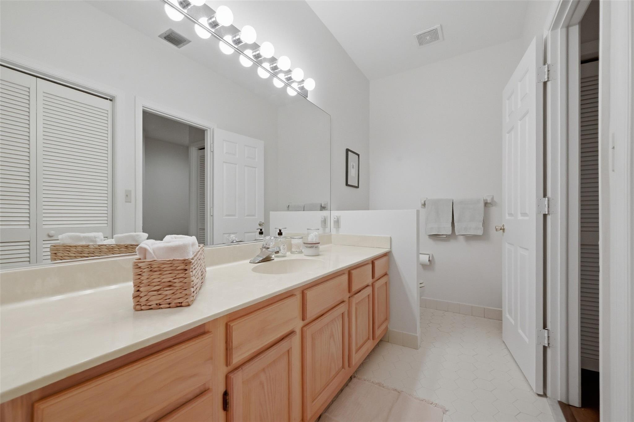 7720 West Upper Ridge Drive Parkland, FL 33067 - Photo 46 of 85 a bathroom with a sink a toilet and shower