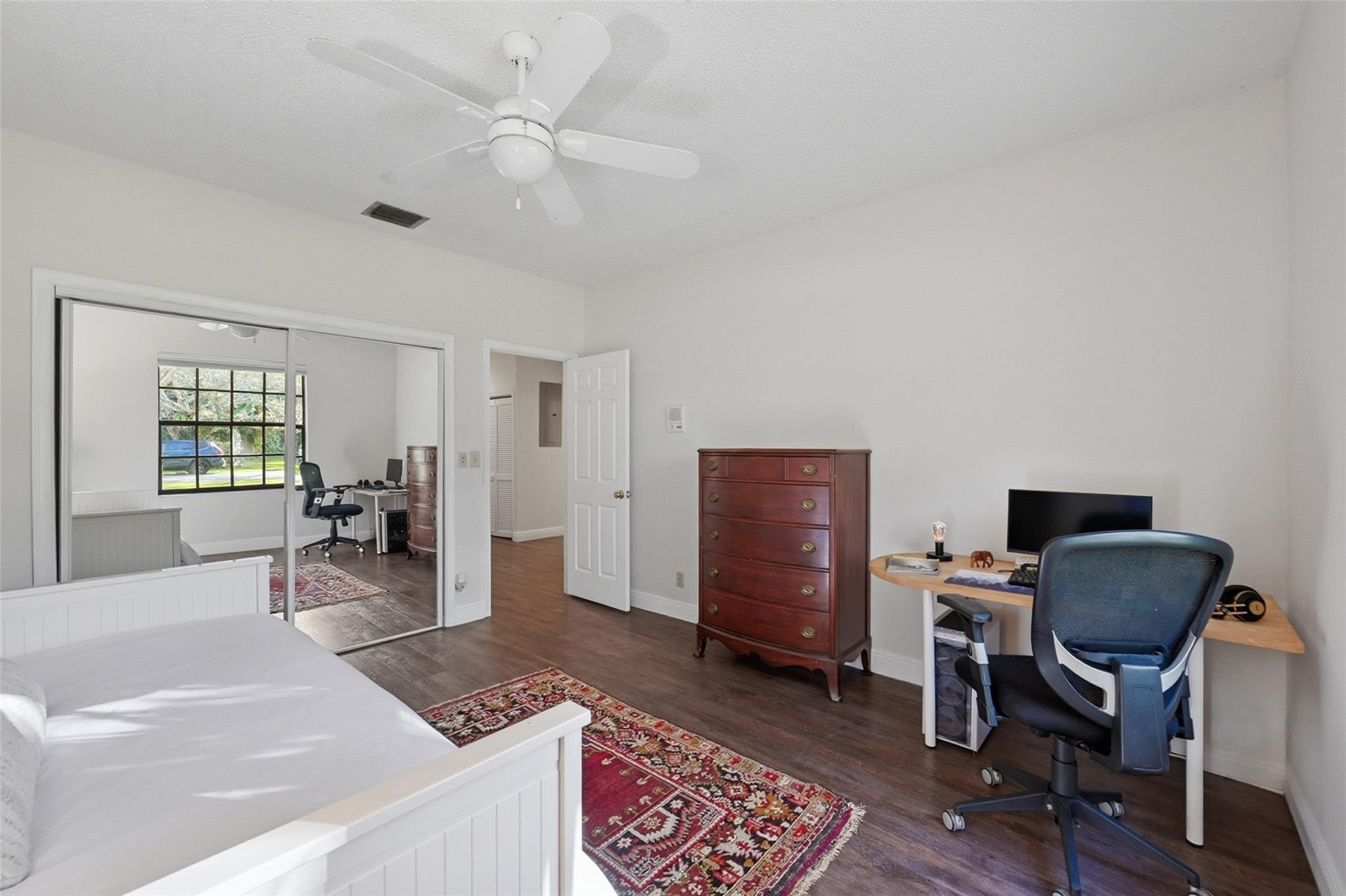 7720 West Upper Ridge Drive Parkland, FL 33067 - Photo 49 of 85 a livingroom with workspace and a window