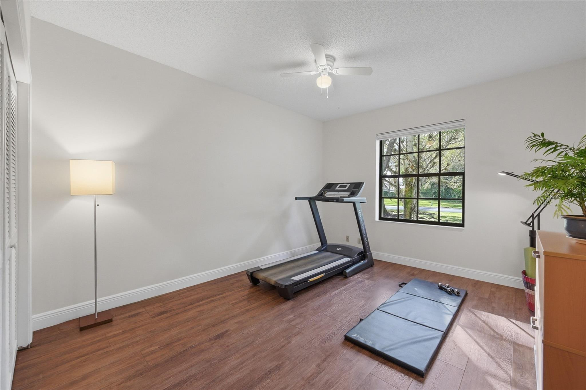 7720 West Upper Ridge Drive Parkland, FL 33067 - Photo 50 of 85 a room with gym equipment and a window