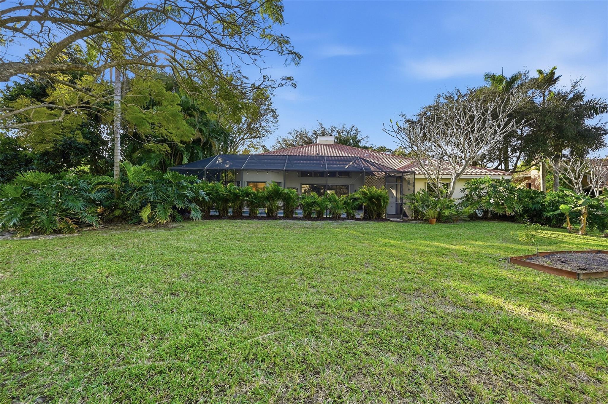 7720 West Upper Ridge Drive Parkland, FL 33067 - Photo 63 of 85 a view of a house with a big yard