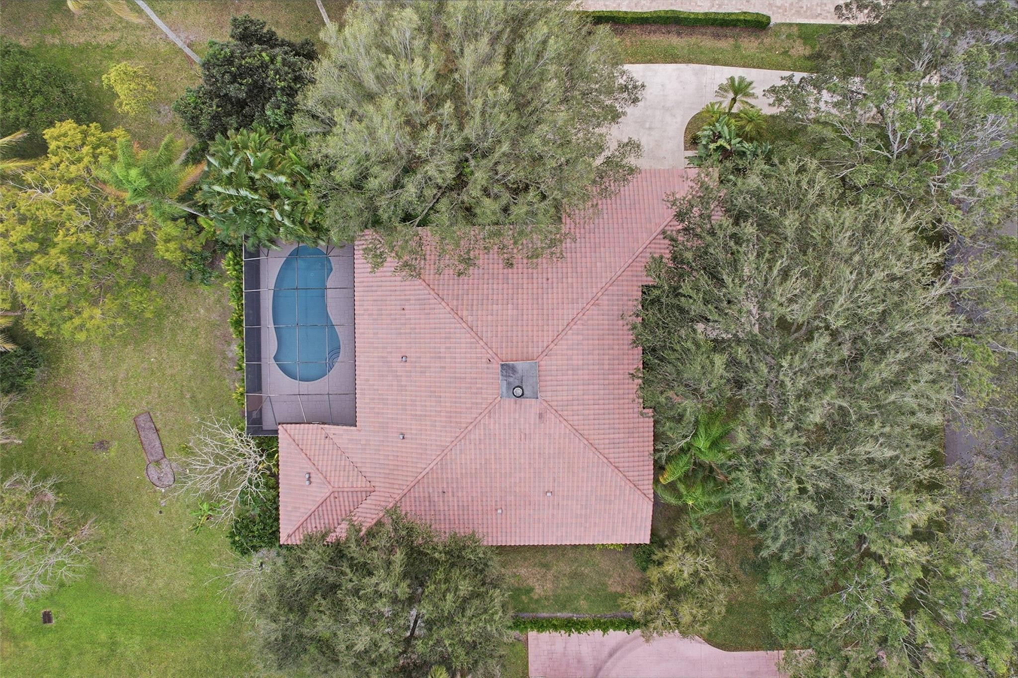 7720 West Upper Ridge Drive Parkland, FL 33067 - Photo 76 of 85 an aerial view of a house with a yard