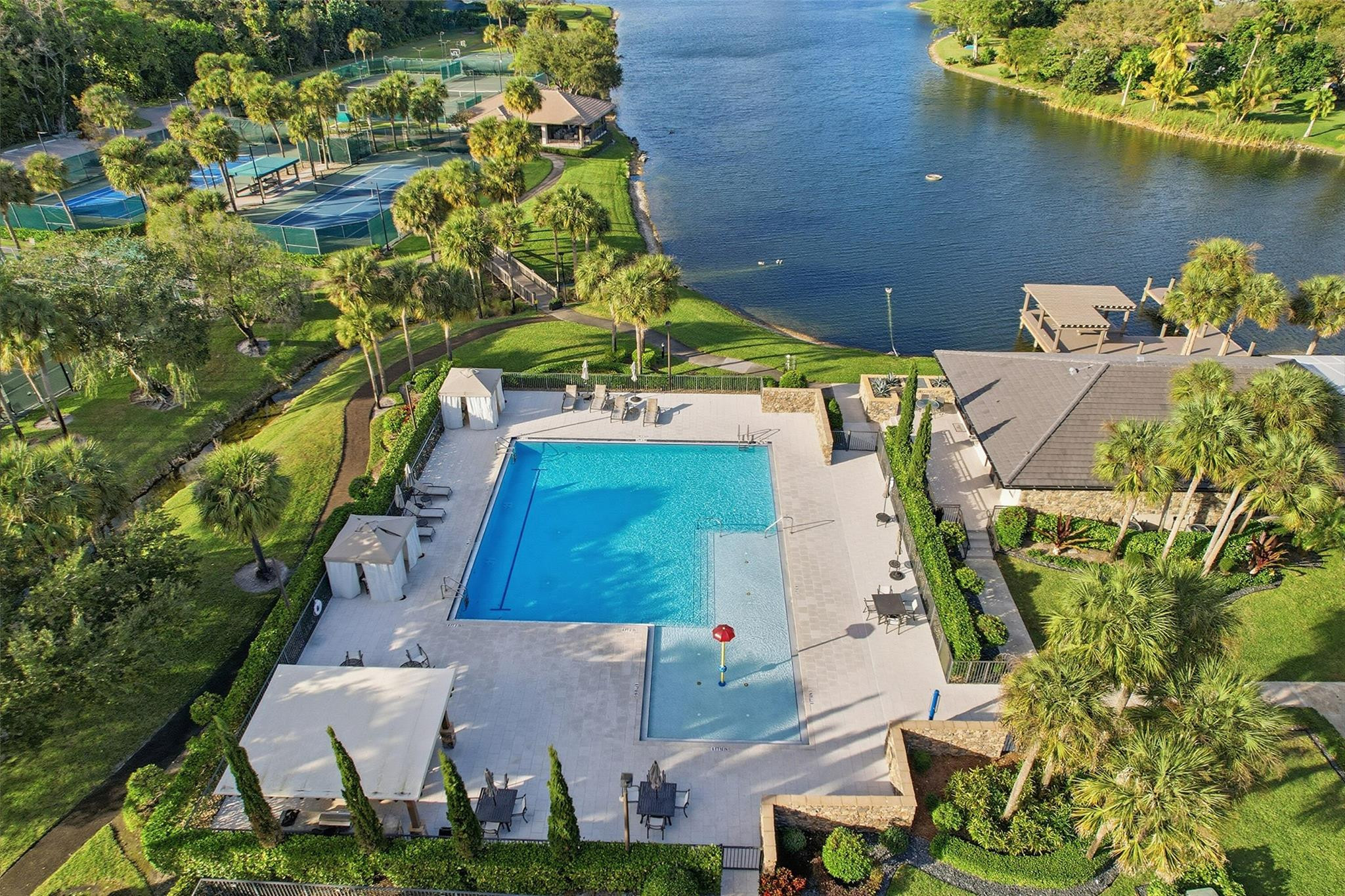 7720 West Upper Ridge Drive Parkland, FL 33067 - Photo 80 of 85 an aerial view of a house with a lake view
