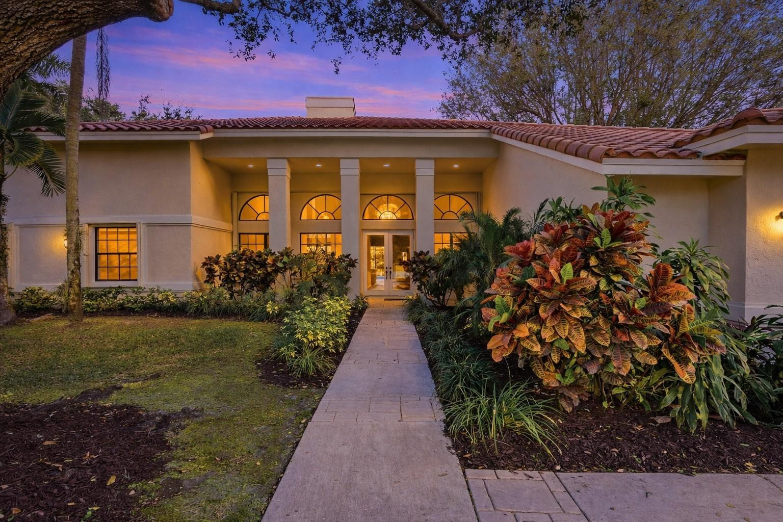 7720 West Upper Ridge Drive Parkland, FL 33067 - Photo 9 of 85 a front view of a house with garden