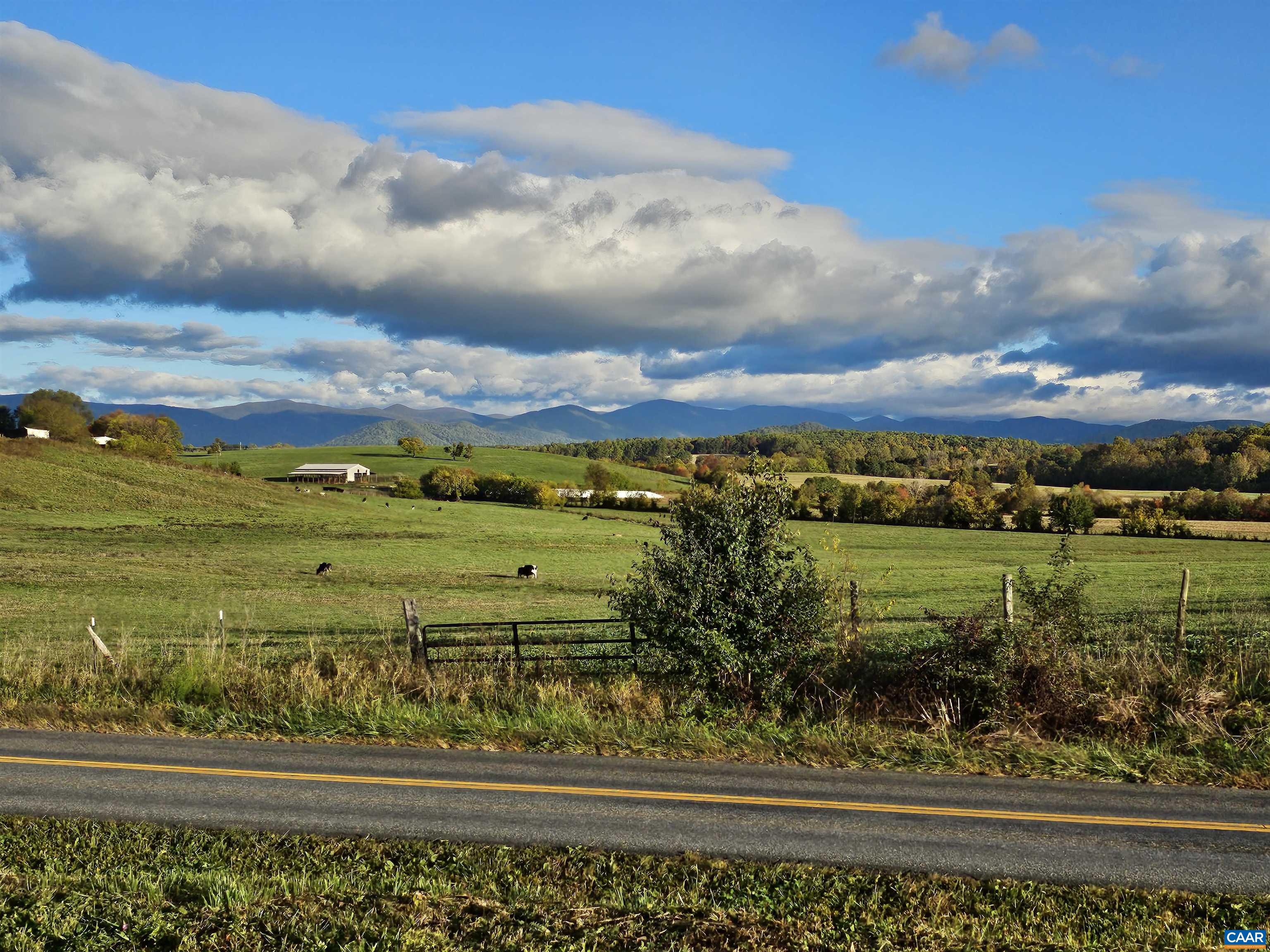 Lot 5 Fredericksburg Road Ruckersville, VA 22968 - Photo 3 of 6 a view of a lake with a house