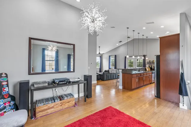 a view of living room with furniture and a chandelier
