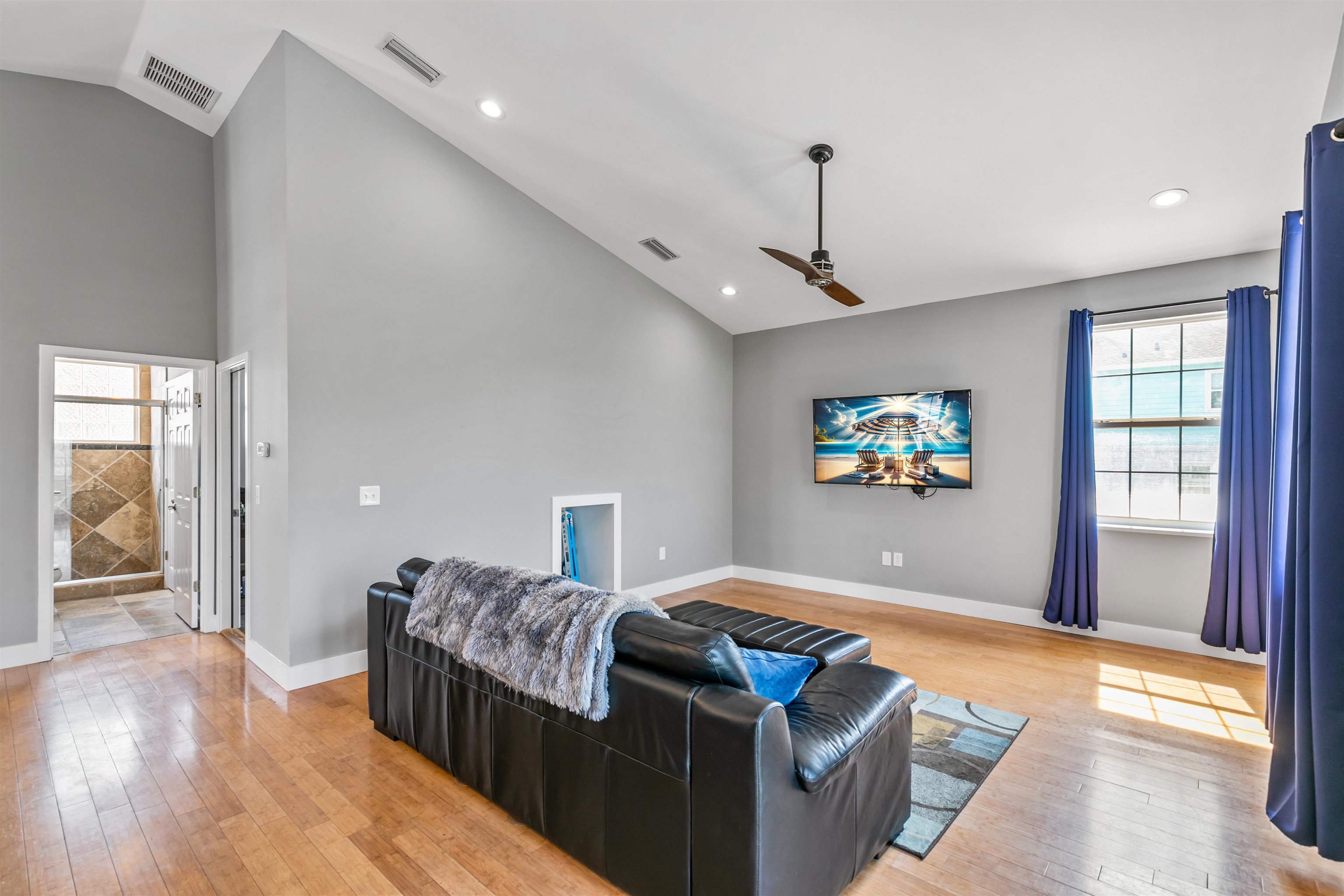 171 Riberia Street St. Augustine, FL 32084 - Photo 27 of 33 a living room with two couches and a flat screen tv