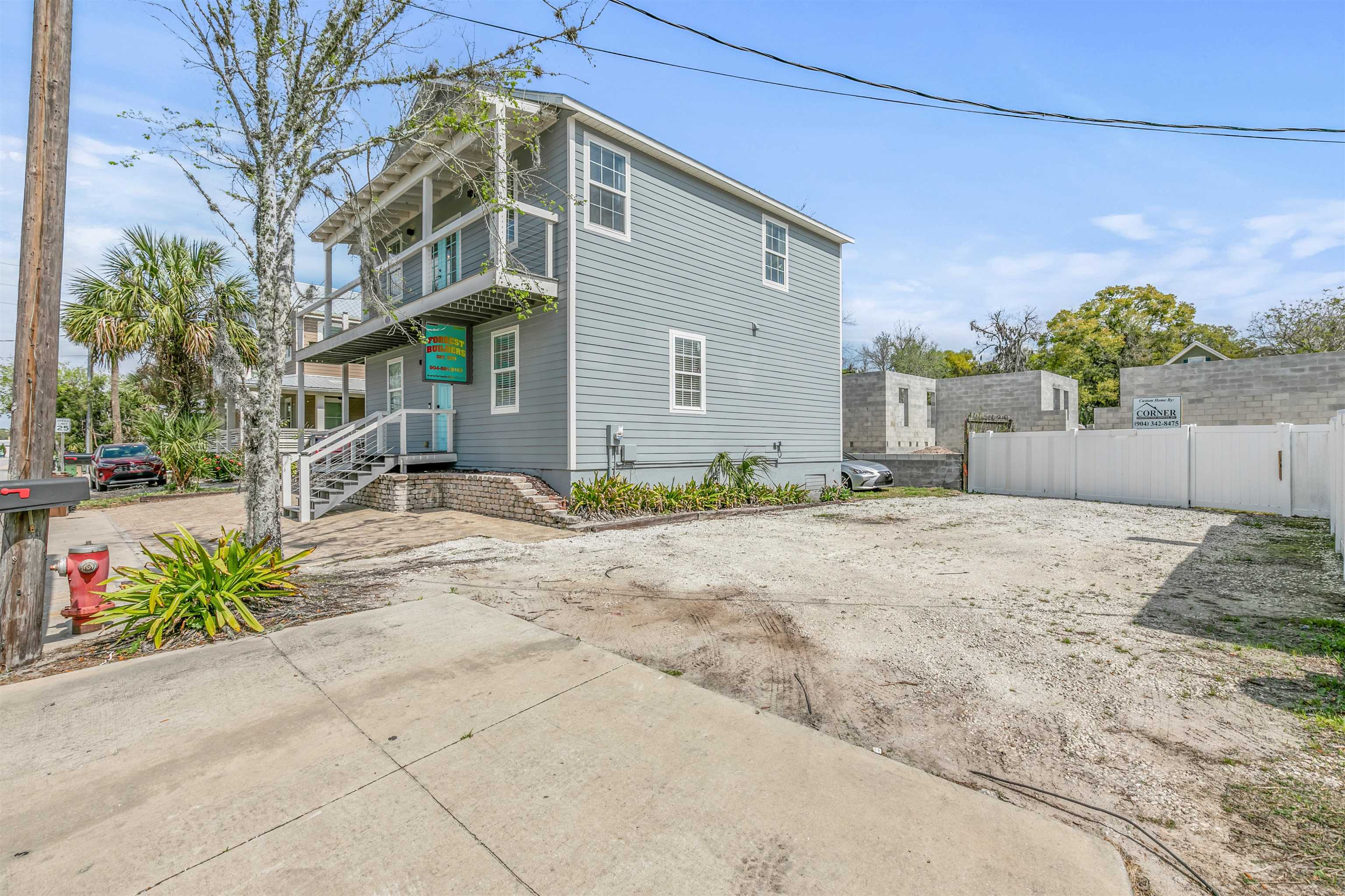 171 Riberia Street St. Augustine, FL 32084 - Photo 31 of 33 a front view of a house with a yard and garage