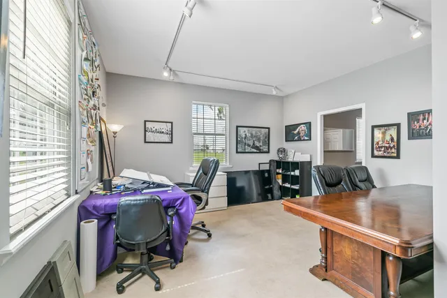 a bedroom with furniture and a window