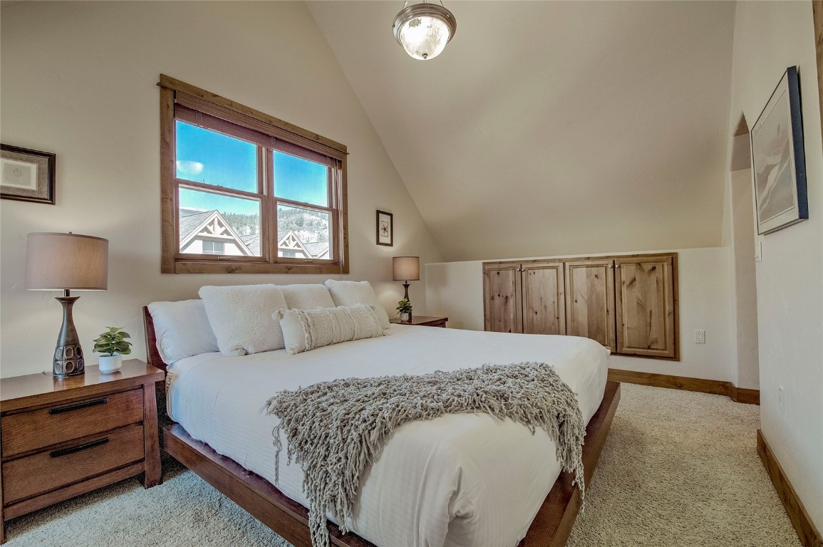 65 Antler Gulch Road, Unit 502 Keystone, CO 80435 - Photo 17 of 41 a bedroom with a bed and window