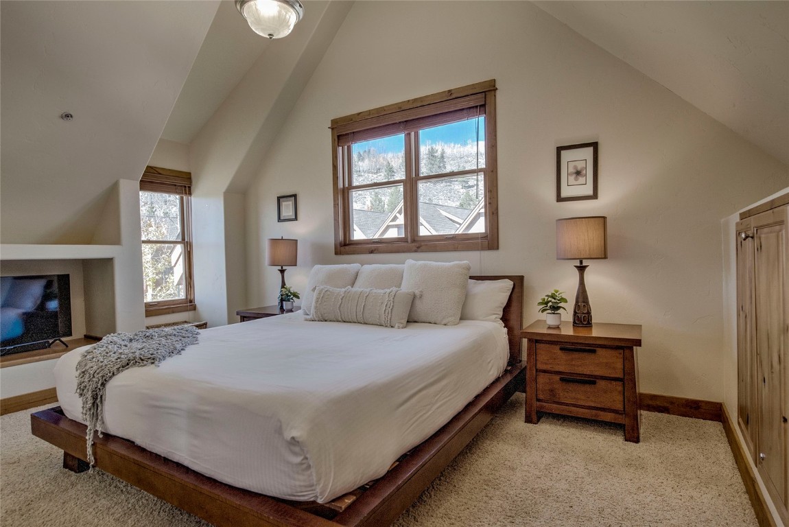 65 Antler Gulch Road, Unit 502 Keystone, CO 80435 - Photo 18 of 41 a bedroom with a bed and a window