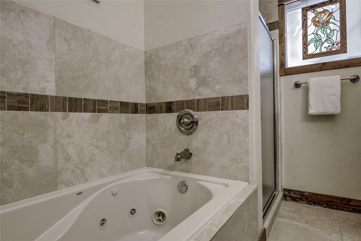 65 Antler Gulch Road, Unit 502 Keystone, CO 80435 - Photo 24 of 41 a bathroom with a tub and shower