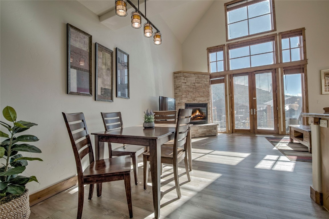 65 Antler Gulch Road, Unit 502 Keystone, CO 80435 - Photo 10 of 41 a view of a dining room with furniture window and wooden floor