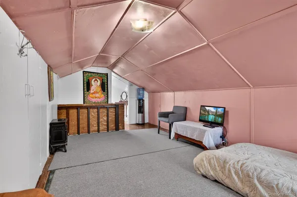a bed room with bed and windows